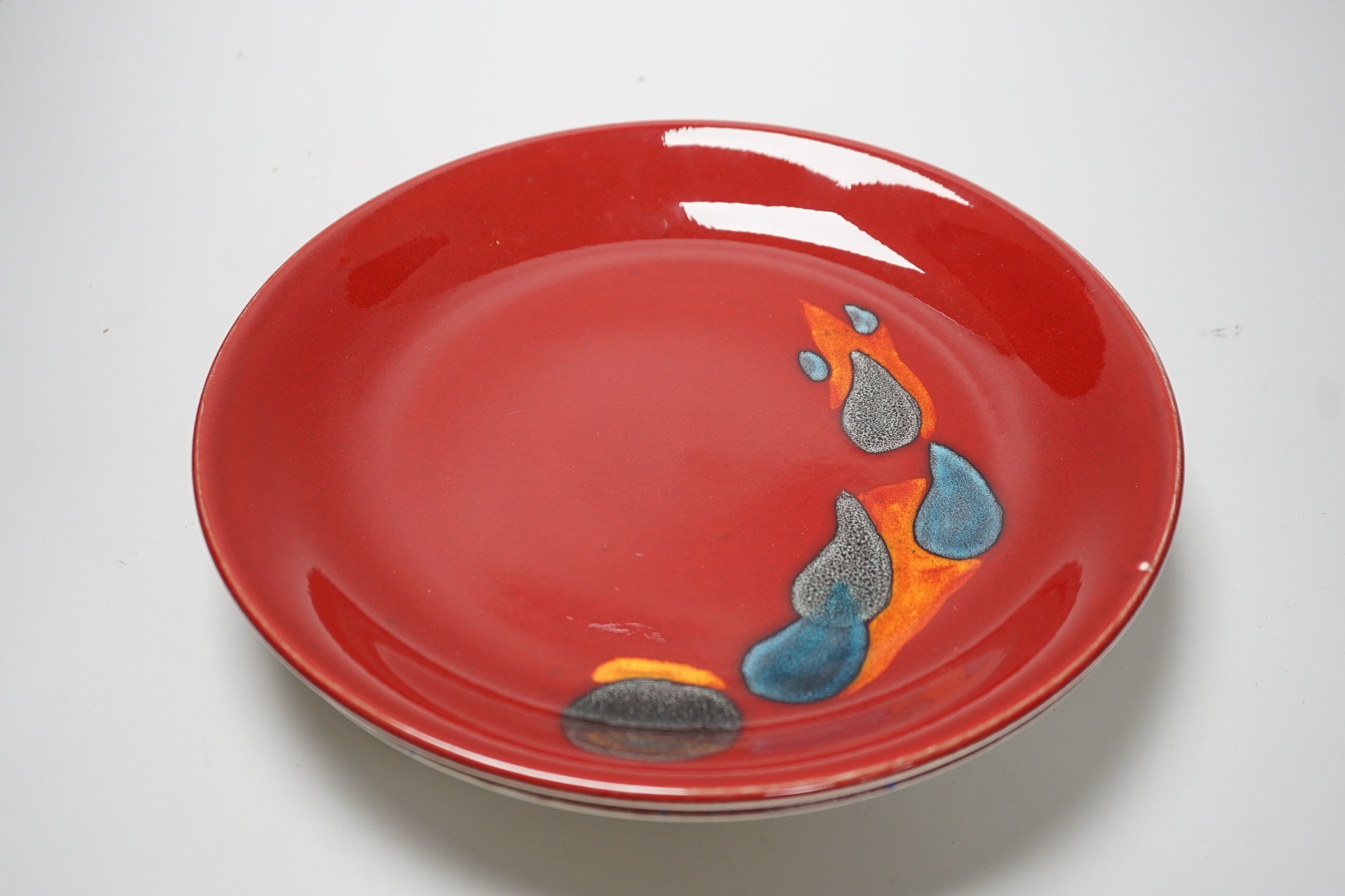 Five items of 1930's/40's Poole pottery, two Delphis plates and a boxed yellow poppy plate